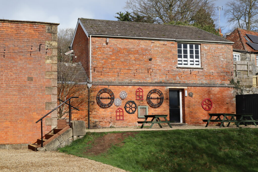 Brick outbuilding and lawn in the school grounds